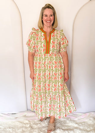 Floral midi dress with contrast neckline, short puff sleeves, and tiered skirt