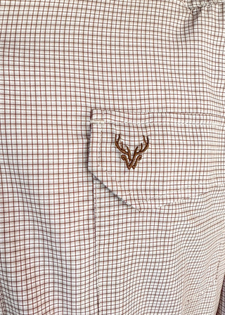 Close-up of a white and brown gingham patterned shirt pocket featuring a brown embroidered deer head logo.