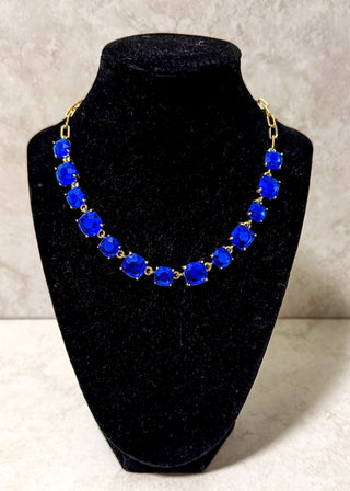 Necklace with bright blue jewels with a gold chain