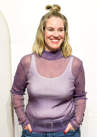 Long sleeve mock neck top with pearl accented sleeves in purple with gold metallic threads.