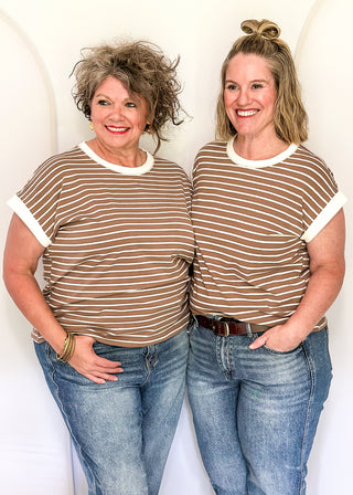 wide striped top with cuffed sleeves, and white banded rounded neckline.