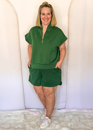 Green scuba drawstring shorts with side pockets