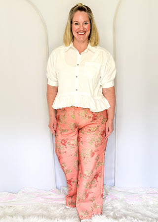 Floral print wide-leg pants in soft coral tones with green accents