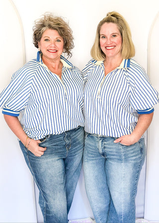 Women’s blue striped short sleeve 1/4 zip top with lightweight fabric, stripe elastic sleeve and collar detail.