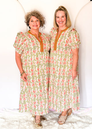 Floral midi dress with contrast neckline, short puff sleeves, and tiered skirt