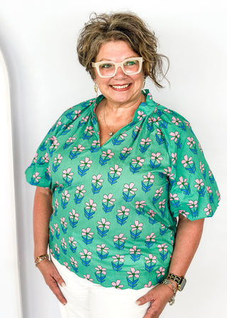 green floral v-neck top with puff short sleeves