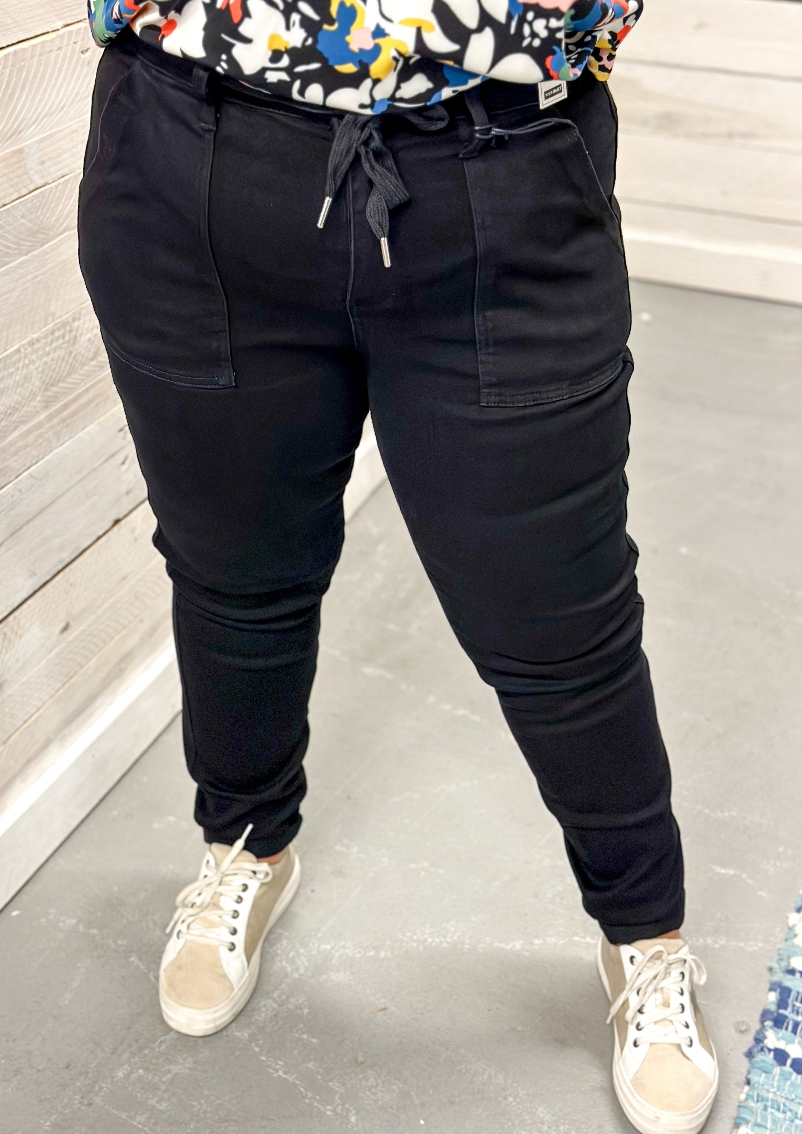 Judy Blue Joggers - Black - cuffed bottom that can be rolled or unrolled - pockets - black drawstring - belt loops - back pockets - elastic waist - front button and zipper