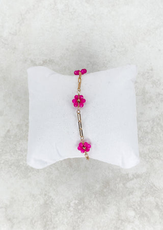 Gold single strand chain bracelet with colored beaded flower. - fuschia