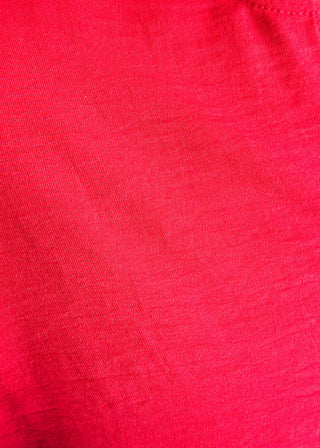 Close up of solid textured blouse with a V-notch neckline, short sleeves
