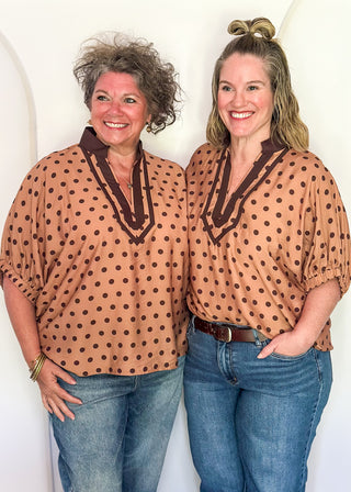 models in camel dolman top with chocolate polka dots.