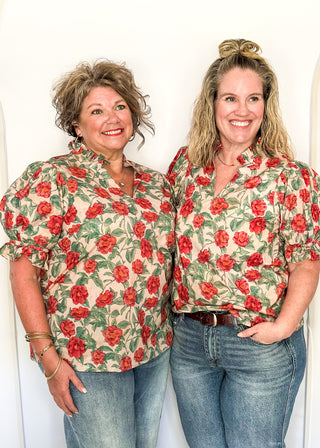 Light Pink short sleeve top, v-neck with ruffle detail.  Elastic detail on the sleeve.  Large Rose pattern with jade leaves. 