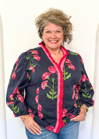 navy floral button up top with pink flowers and 2 shades of pink trim/ruffles along collar and down center