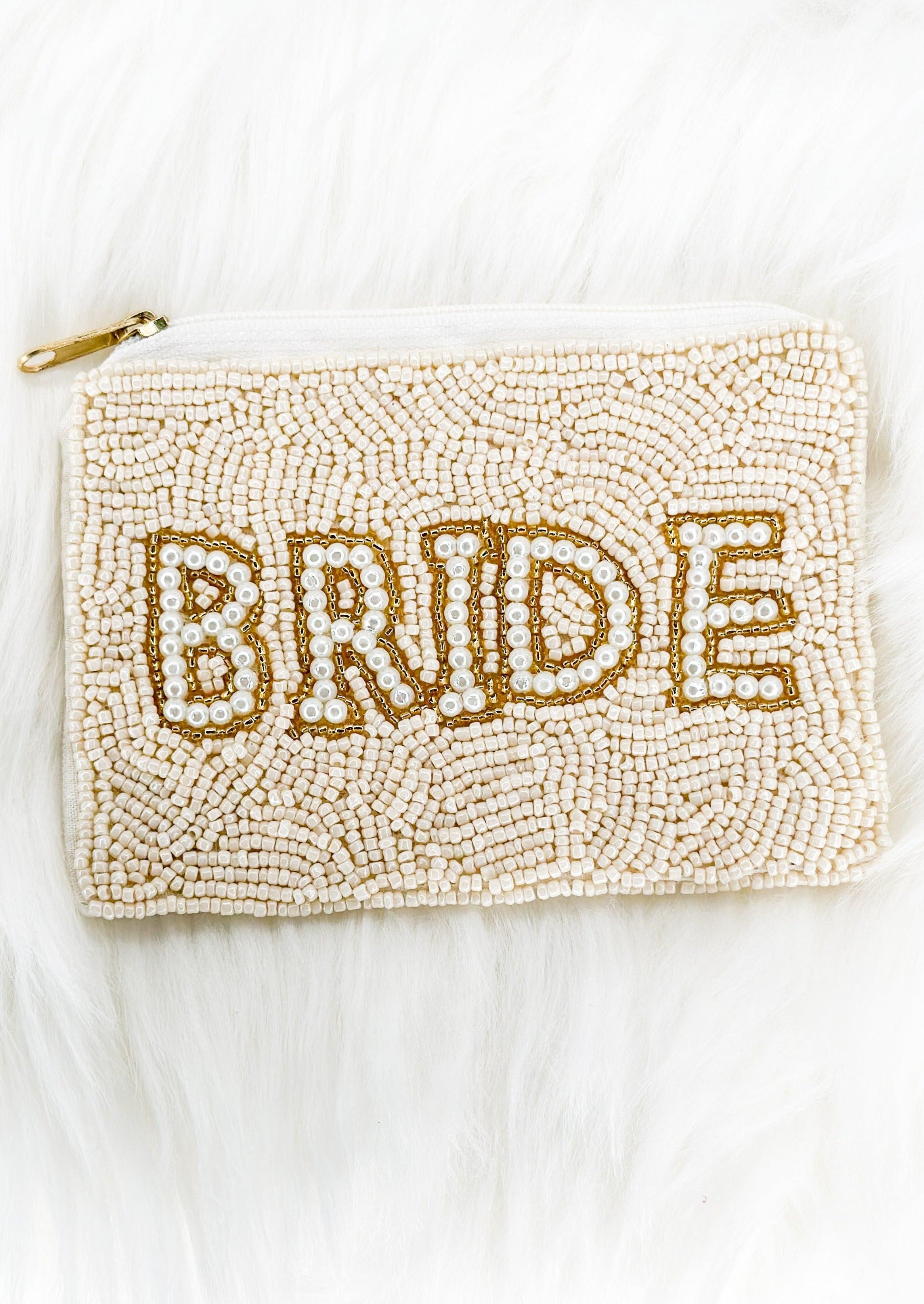cream seed bead coin purse with gold zipper and bride spelled out on one side in cream with gold bead trim