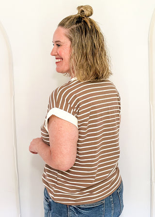 wide striped top with cuffed sleeves, and white banded rounded neckline.
