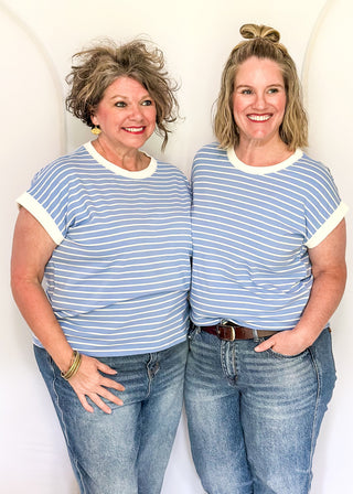 wide striped top with cuffed sleeves, and white banded rounded neckline.