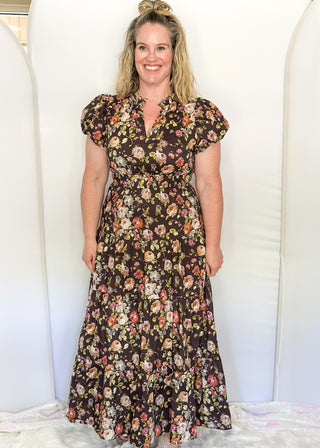 Brown with fall florals, short sleeve tiered maxi dress.  V-neck and puff sleeve and lined. 