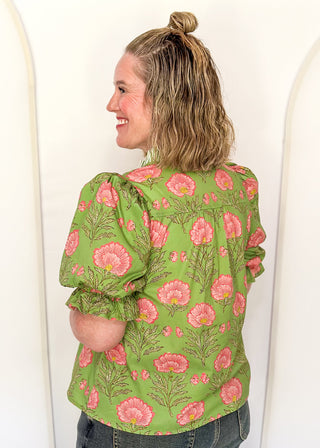matcha green floral puff sleeve blouse with pink oversized floral print and striped contrast trim along the neckline and front placket.