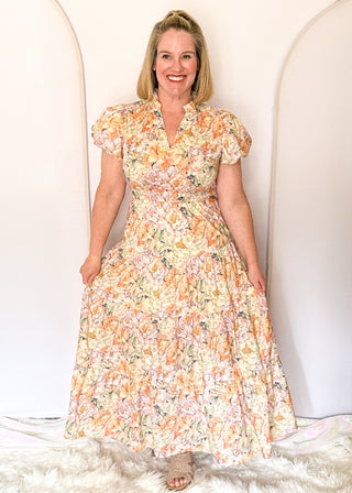 Floral maxi dress with short puff sleeves, elastic waist, and flowy maxi skirt