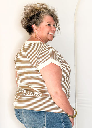 mocha and white striped short sleeve top with white banding on sleeve and collar. 