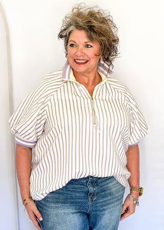 Women’s lavender striped short sleeve 1/4 zip top with lightweight fabric, stripe elastic sleeve and collar detail.