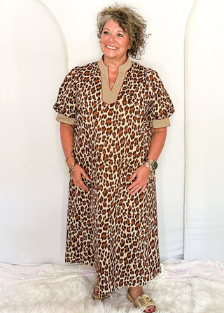 woman standing in leopard print Maxi Dress