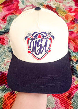 Patriotic snapback hat with navy brim and USA patch detail