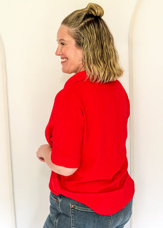Red collared top with v-neckline 