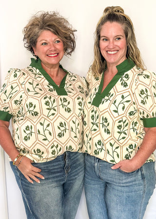 Neutral blouse featuring green florals with geometric hexagon pattern