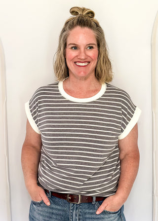 wide striped top with cuffed sleeves, and white banded rounded neckline.