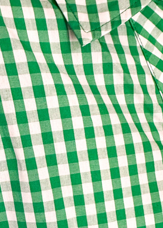 Close up of gingham blouse with split neckline, collar, and 3/4 sleeves.