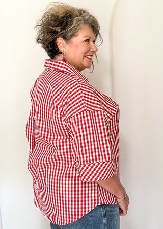 Gingham blouse with split neckline, collar, and 3/4 sleeves.