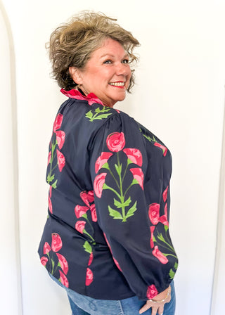 navy floral button up top with pink flowers and 2 shades of pink trim/ruffles along collar and down center