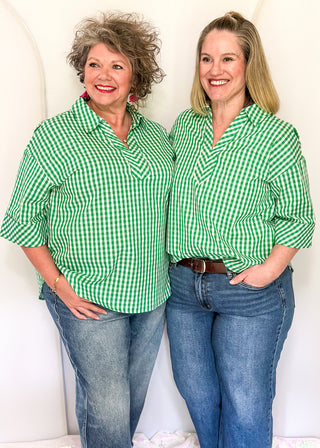 Gingham blouse with split neckline, collar, and 3/4 sleeves.