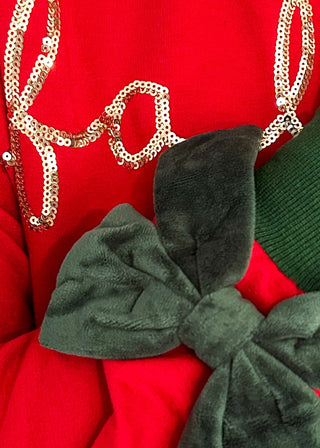 close up of velvet bow/sequin letter detail