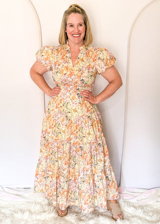 Floral maxi dress with short puff sleeves, elastic waist, and flowy maxi skirt