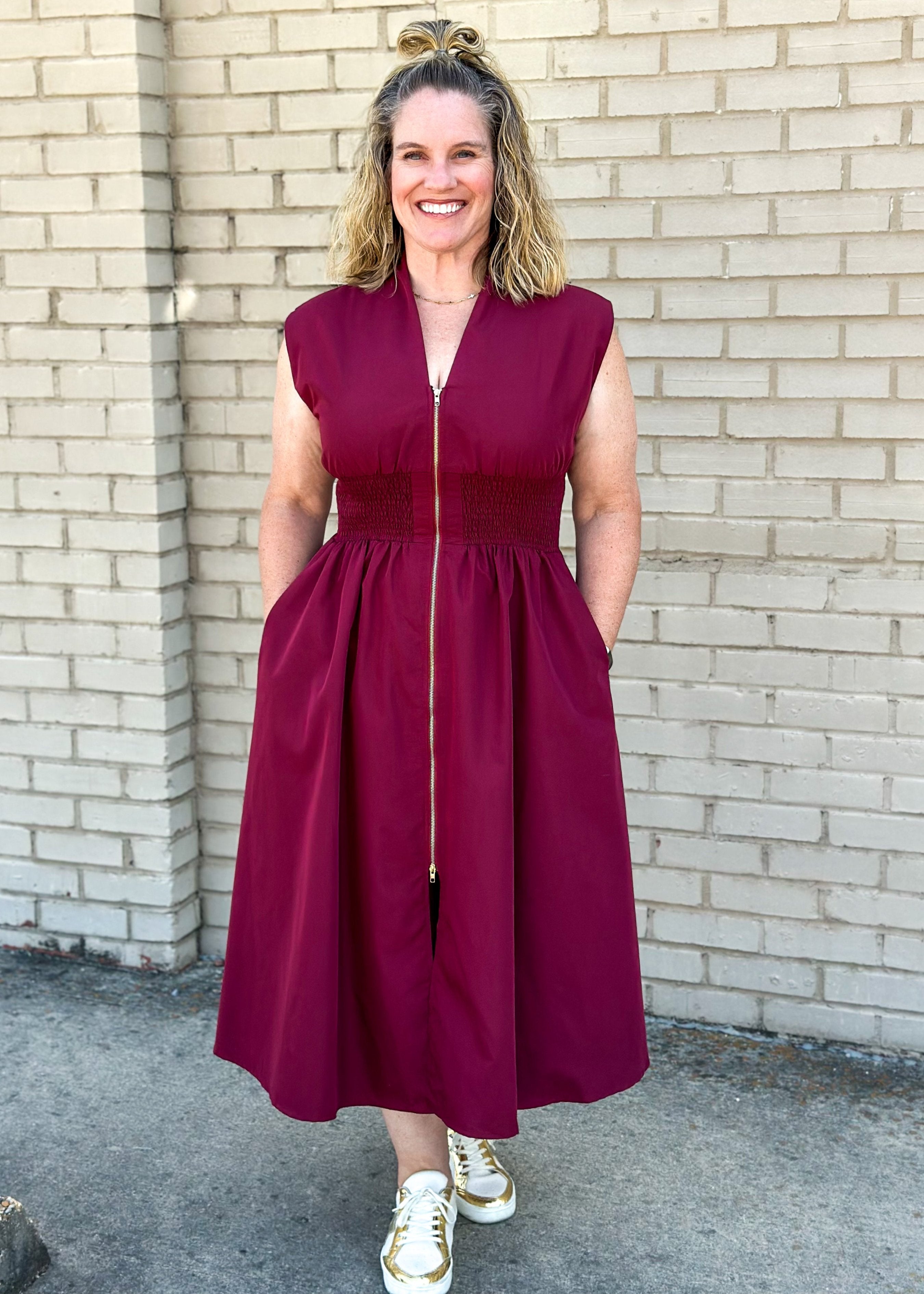 entro brand merlot colored midi dress with gold zipper down the front, smocked waistband, lined and pockets