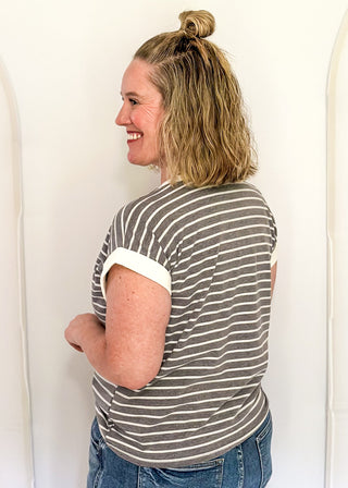 wide striped top with cuffed sleeves, and white banded rounded neckline.