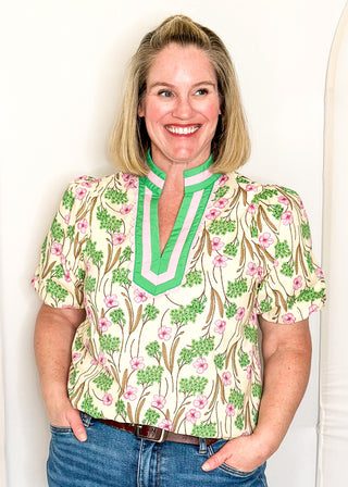Spring floral top with short sleeves, easy silhouette, and colorful pink and green pattern