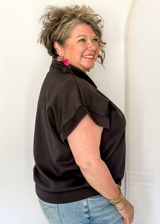 Black scuba athleisure top with gold zip neckline and relaxed fit