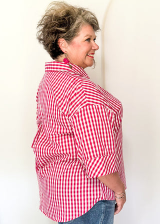 Gingham blouse with split neckline, collar, and 3/4 sleeves.