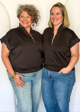 Black scuba athleisure top with gold zip neckline and relaxed fit