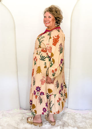 Camel background midi dress with multicolor floral design and long sleeves