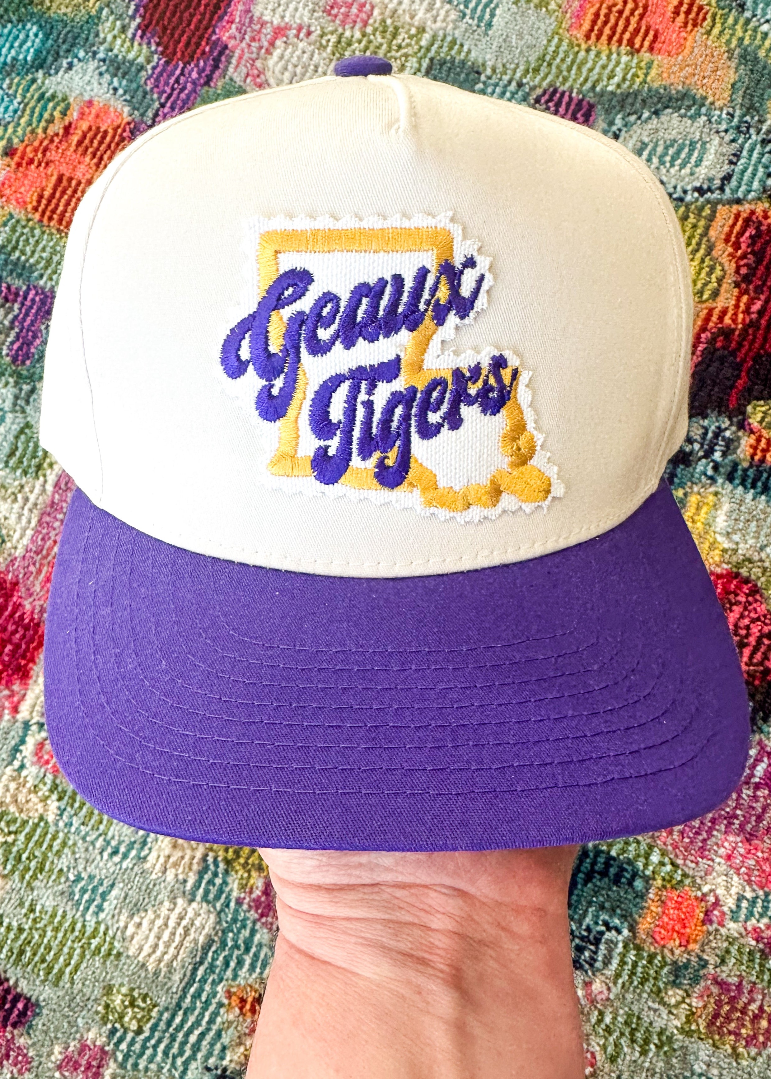 Louisiana embroidered patch with Geaux Tigers across it.
Snap closure.