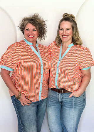 Striped button-down top with V-neckline, short puff sleeves, and contrast trim detailing