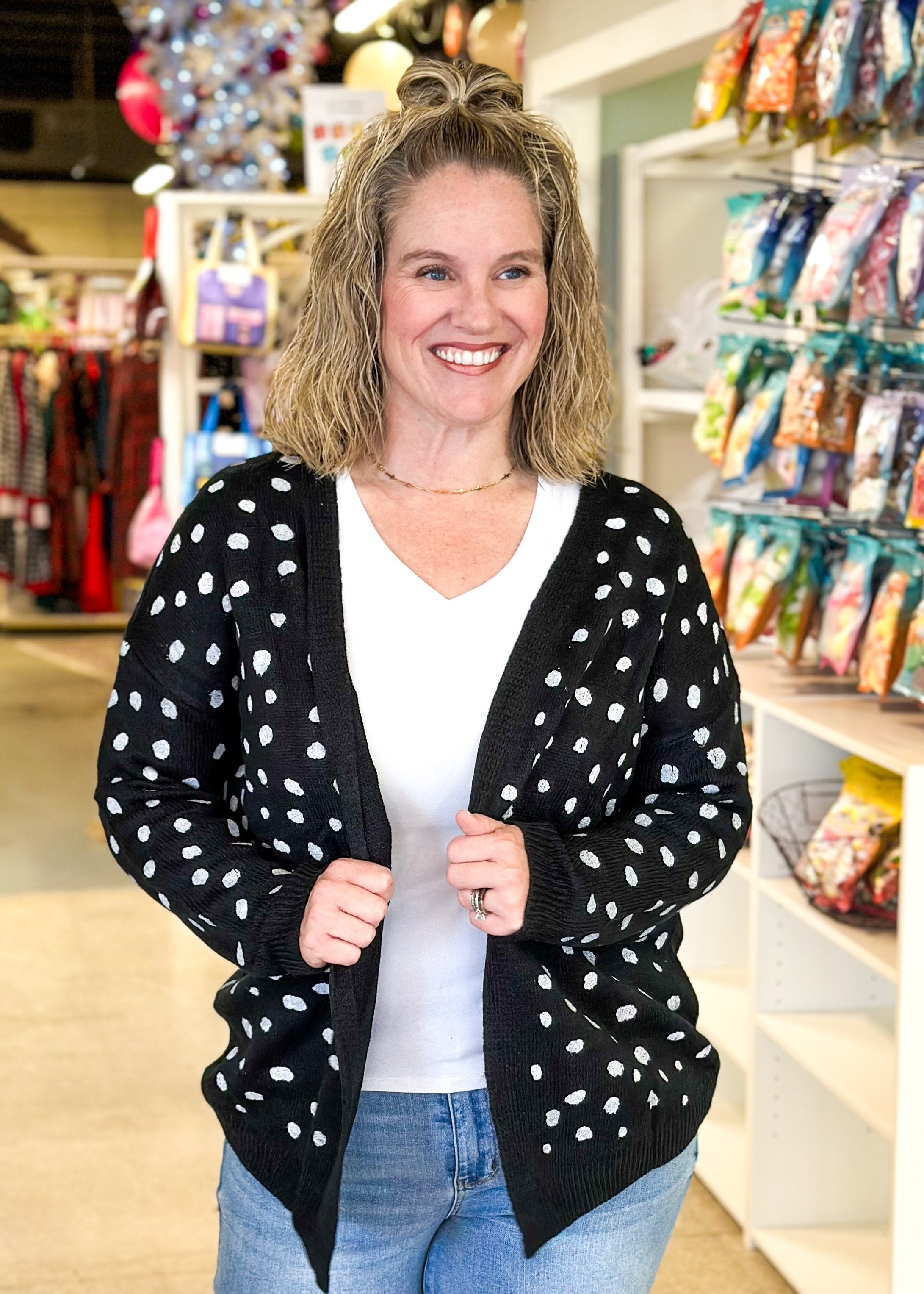 open black cardigan sweater with white spots like a dalmation 