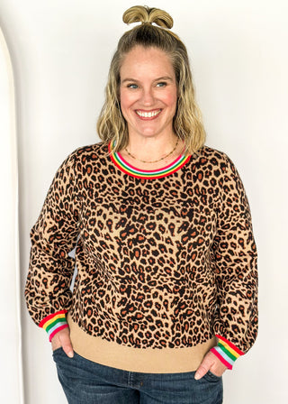 Long sleeve sweater in bold leopard print and colorful stripe collar.