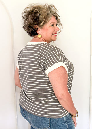 wide striped top with cuffed sleeves, and white banded rounded neckline.