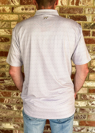 A man viewed from behind wearing a short-sleeve button-up shirt with a fine white and light red micro-pattern, standing in front of a rustic brick wall.