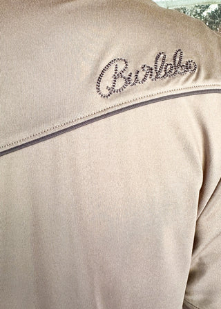 tan western style polo w/pearl snaps, front pocket on left side and embroidered ducks on either shoulder