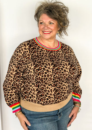 Long sleeve sweater in bold leopard print and colorful stripe collar.